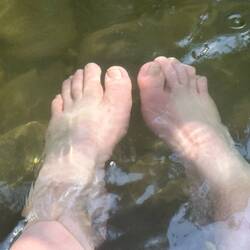 Happy feet cooling in the river