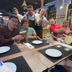 A humerous photobomb by the playful servers and a neighboring diner.