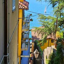View of Lake Como and sailboat