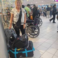 The airport was so busy. We found a small space to wait to check our bag. Great people watching