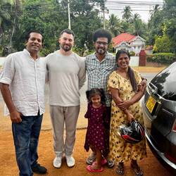 Sam with our driver (left) and his friends family