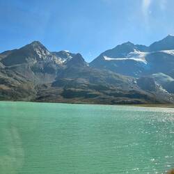 Lake with glacier above in mountains