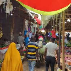 This guy, riding his moto in the market. Sheesh