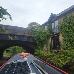 Home built around a bridge. You can see the date of the bridge