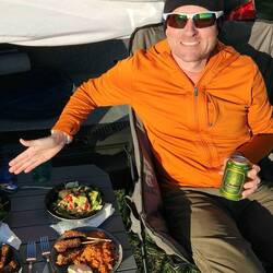 Venison skewers, hummus, peri peri rice, and salad