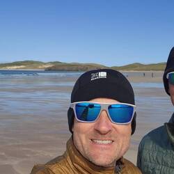 Keeping warm on the summer beach walk.