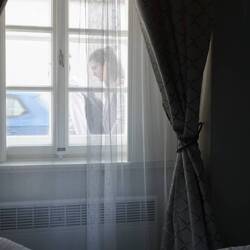 Window next to the bed of our apartment where we can people watch.