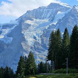 Close up of glacier with train tracks (electric) in foreground