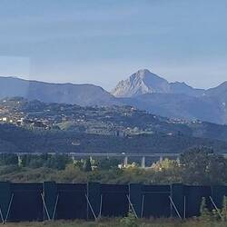 Journey to Lucca from Viareggio on the train. The marble mountains of Versillia