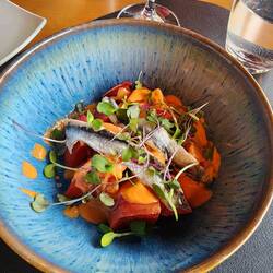 Fresh tomatoes and anchovies.