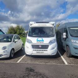 Our parking spot mirrors tucked in. The little car took spot where full sized car was