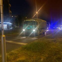 Huge entourage of vehicles with police sirens wailing near our apartment.