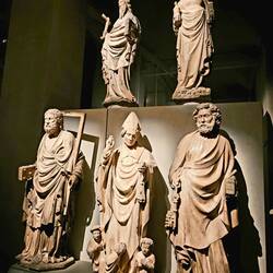 Copies and original statues in museum