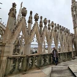 Charlie amidst the first level of elaborately carved rooftop sculptures
