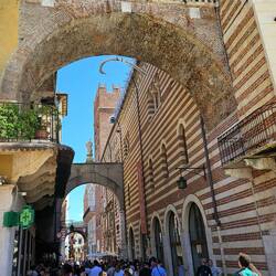 Street scene with arches and 14th century building