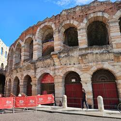 Another view of arena with tacky signage and barriers