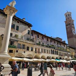 Piazza Erbe - Roman towers and columns. Market in progress