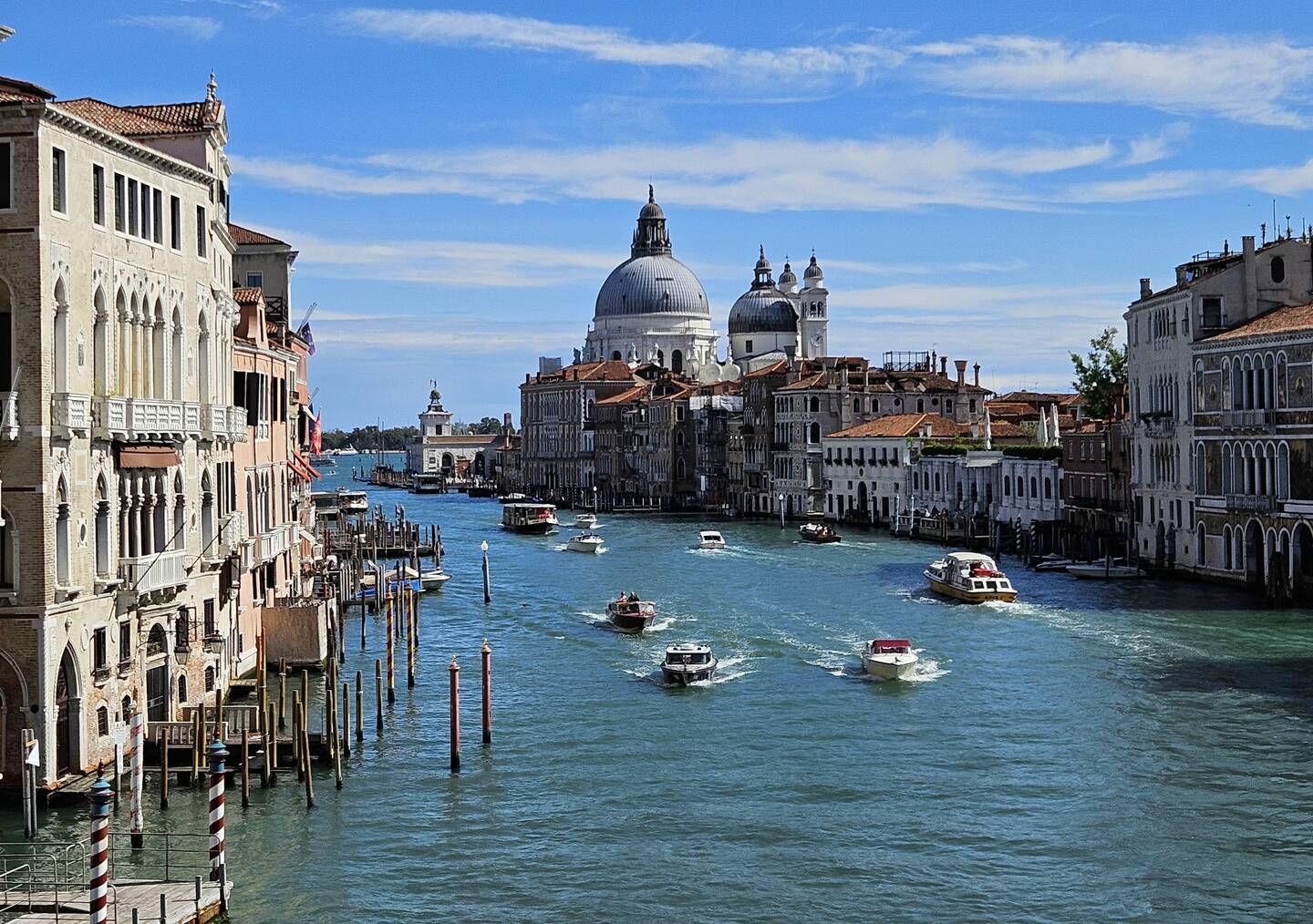 Venice Grand Canal with boats and domed cathedral