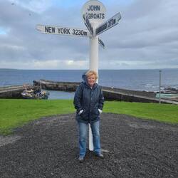 John O Groats sign post. They've painted it and moved all stickers to a wall.