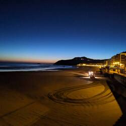 Leaving Zarautz Sand groomer headlights seen