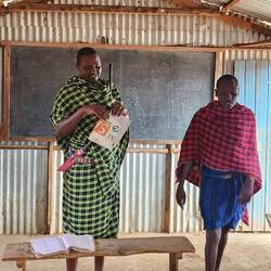 the principal in green dress