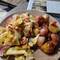 Fresh red potatoes, red onions, and tomatoes
