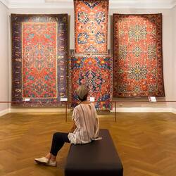 Aylin enjoying a selection of carpets from Türkiye's Uşak Province — Arkas Sanat ... Bornova, İzmir.