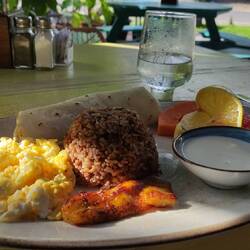 Gallo pinto with scrambled egg, plantain, fruit and corn cake