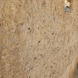 This is an actual wall of house, you can see the mud and hay in the material
