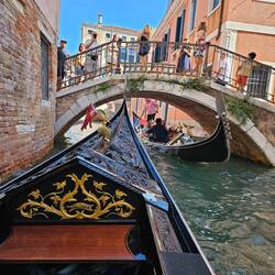View of our gondola approaching another under a low bridge