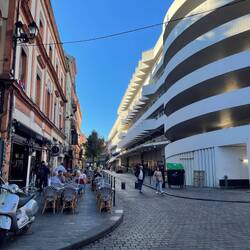 The market has a large white parking complex on top of it.