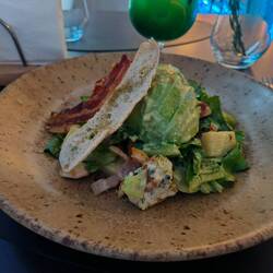 Cooked chicken Romani salad with avocado. Had blue cheese in it too .