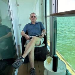 Doug enjoying the cabin's balcony atmosphere