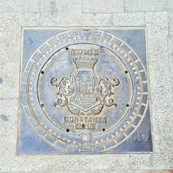 Every city has these manhole plates with the coat of arms on