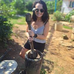 Grinding down the coffee beans the traditional way.