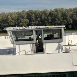 Wheelhouse can actually be dropped to fit under bridges - not a problem with current low waters