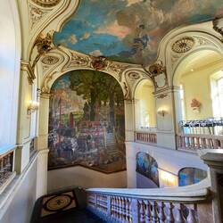Top of the staircase with painting of the first session of the Floral Games