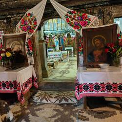 Traditionally, the women's room is at the entry, then the men's room, then the alter.