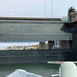 Roadway overhead stays in place while boats slip underneath