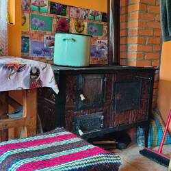 Maria's very proud of her stove, it certainly warmed up the room on a frosty morning