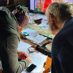 Putting in a new SIM card for Vasile.