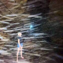 Long exposure times of the mobile camara made little insects (that flew around in the cave) visible