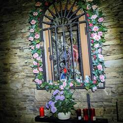 Shrine in a brick wall on the trail out of Tineo