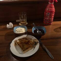 Like a creape with sugar on the top then it is heated with a branding iron for the caramelizarion