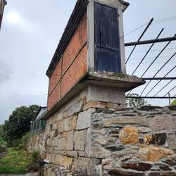 Grainery, keeps the seeds off the wet ground and the rats out