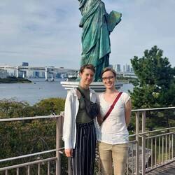 In front of Statue of Liberty