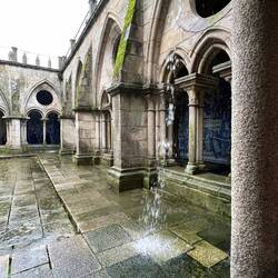 We sought shelter in the cloisters as the rain bucketed down