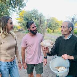 The owner of the Farmstay with his foraged mushrooms