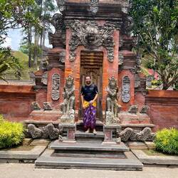 Me posing in front at one of the richly decorated gates at Puri Titra Empul (the holy water temple)