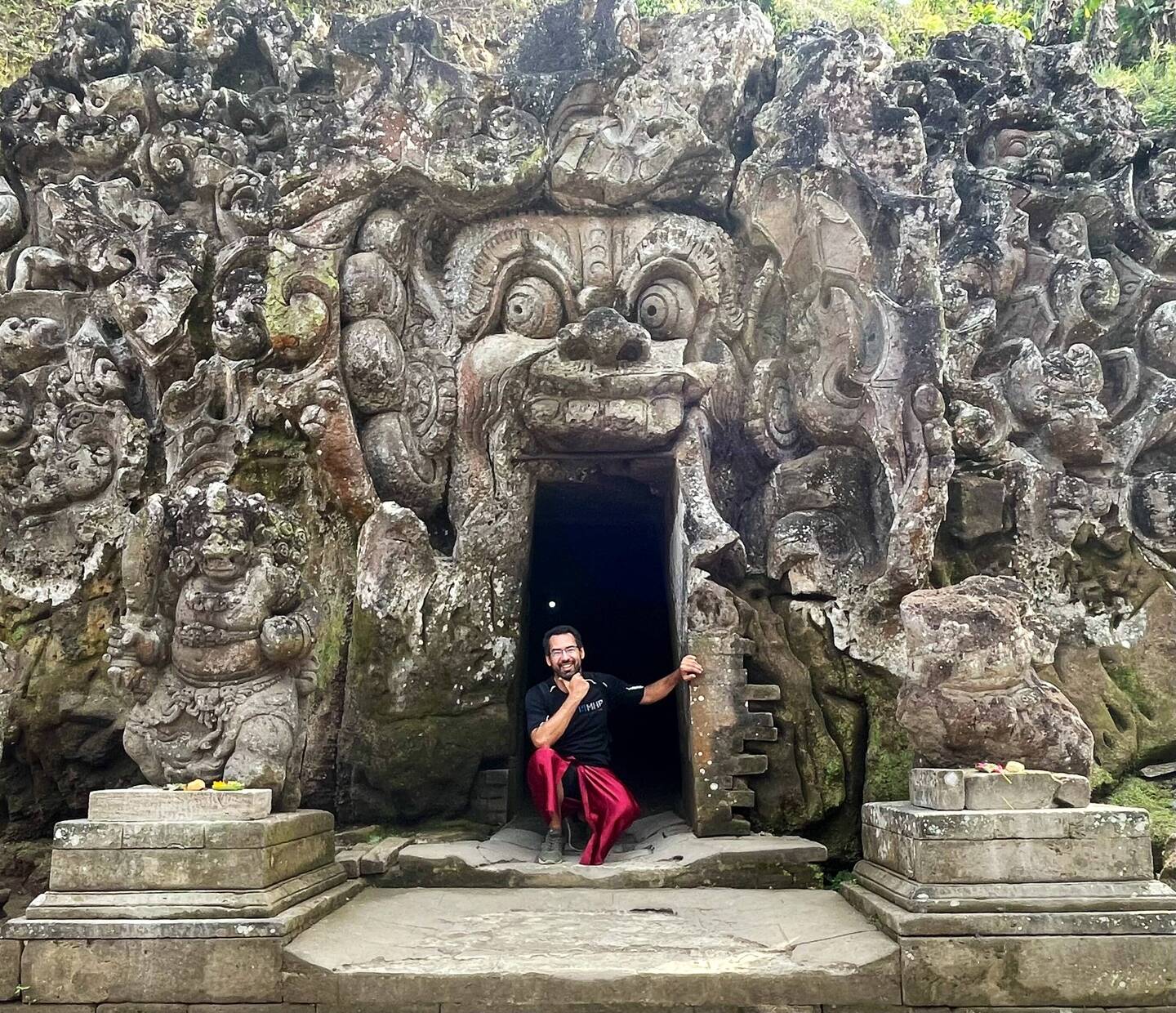 Me posing at the entrance of a cave at Goa Gajah